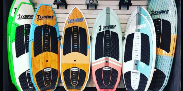 store setup of different style doomswell wakesurf boards