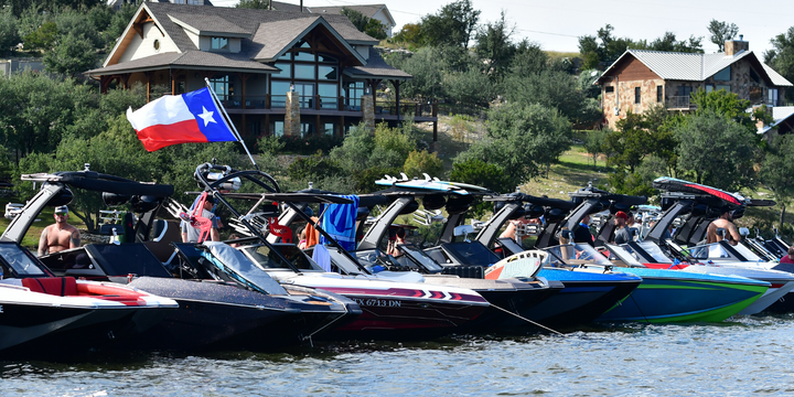 line of wake boats on the lake